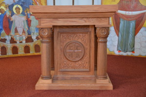 Fr. Onisie Morar, a dear friend of the parish, built and carved the new altar from wood re salvaged from our old, damaged, pews.